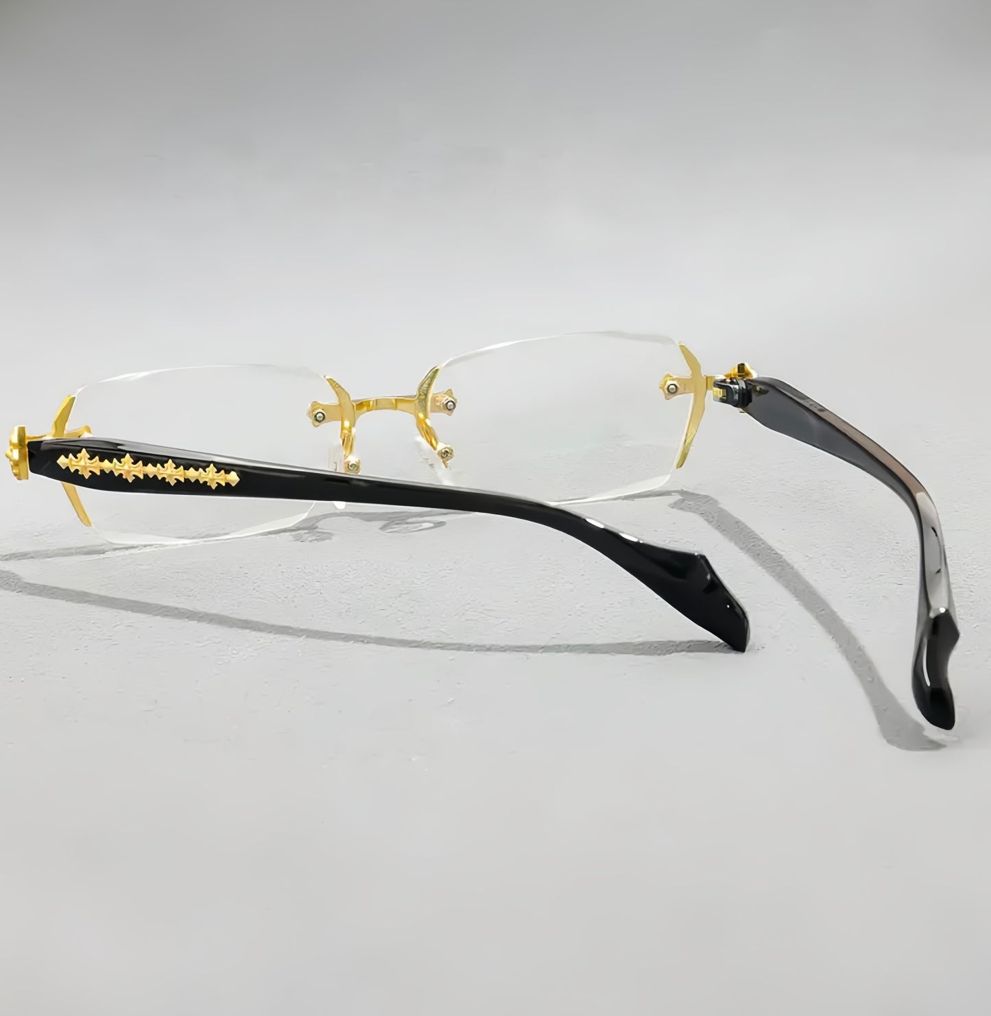 Iz Refined Elegance: Vintage-Inspired Rimless Eyewear Frame with minimalist Gold Design.